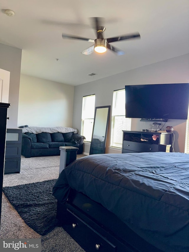 carpeted bedroom featuring ceiling fan