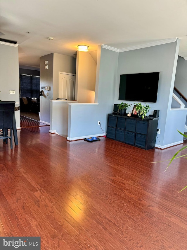 living room featuring dark hardwood / wood-style floors and ornamental molding