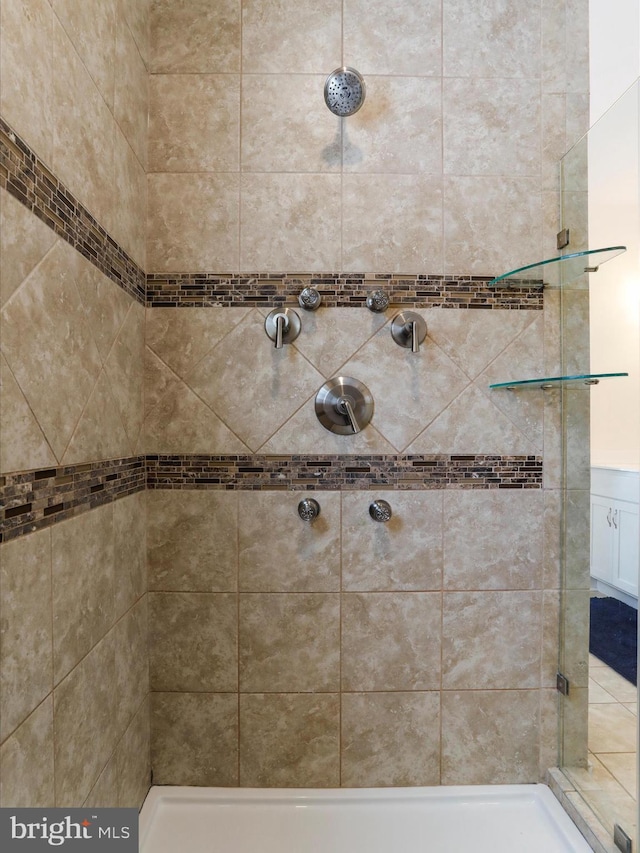 bathroom with a tile shower