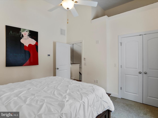 bedroom featuring carpet, ceiling fan, and a closet