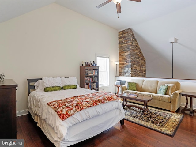 bedroom with ceiling fan, dark hardwood / wood-style floors, and high vaulted ceiling