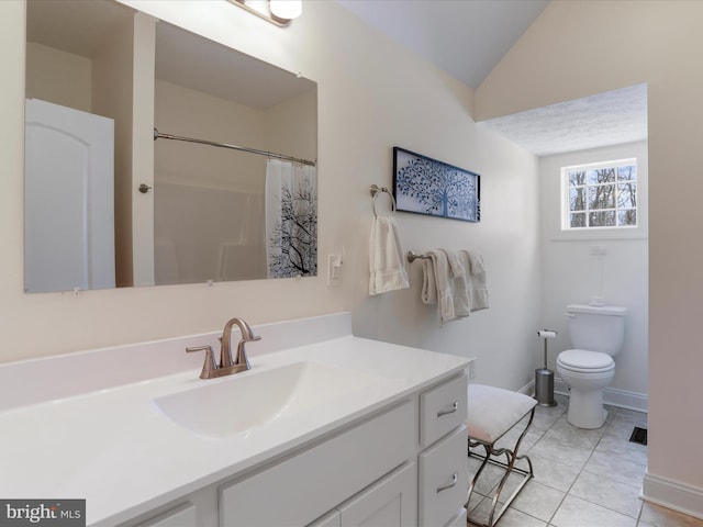 bathroom with lofted ceiling, tile patterned flooring, vanity, walk in shower, and toilet