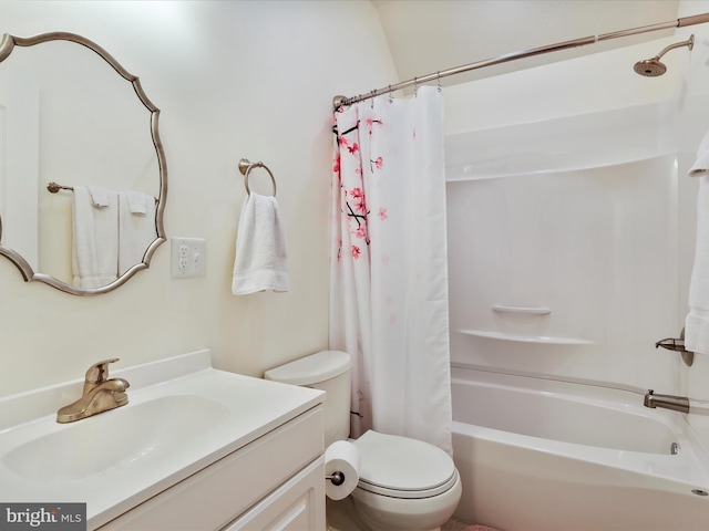 full bathroom with vanity, shower / tub combo with curtain, and toilet