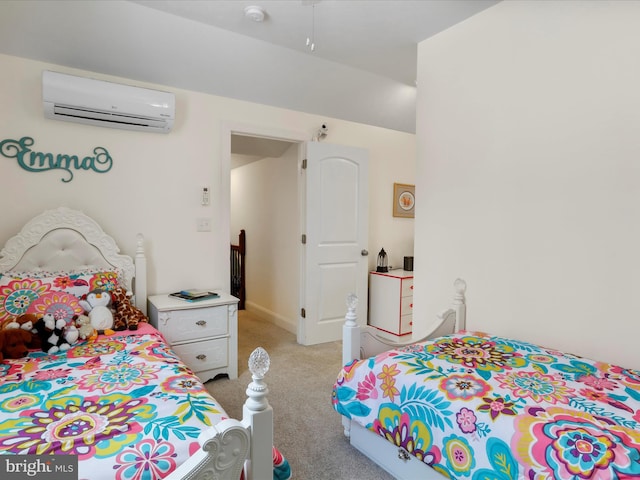 carpeted bedroom featuring a wall mounted AC