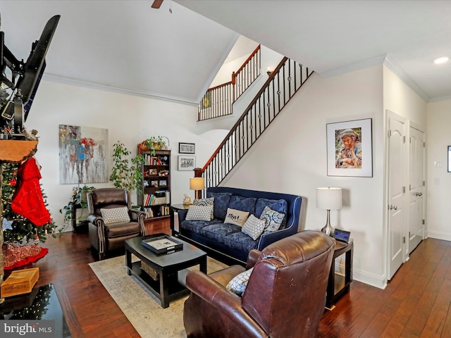 living room featuring crown molding, dark wood-type flooring, and ceiling fan