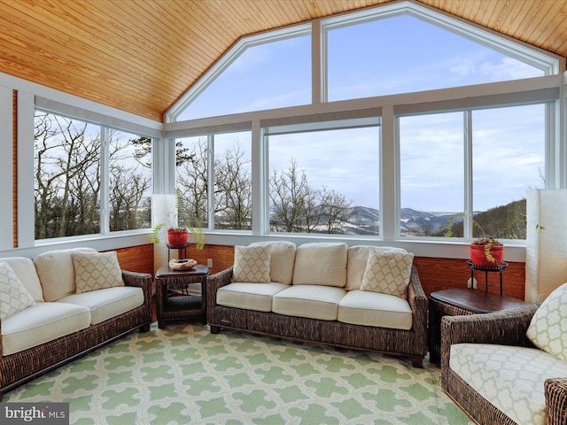 sunroom / solarium featuring lofted ceiling and plenty of natural light