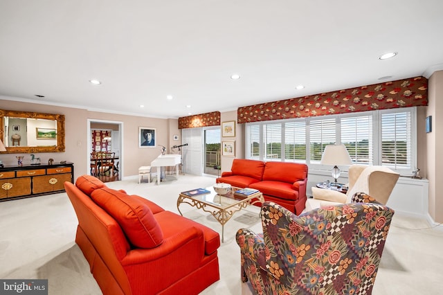 carpeted living area with baseboards, ornamental molding, and recessed lighting