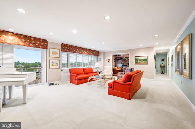 living area with recessed lighting, baseboards, ornamental molding, and light colored carpet