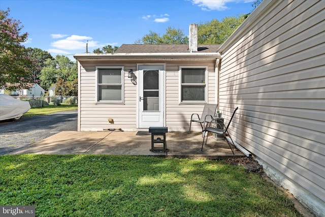 exterior space featuring a yard and a patio area