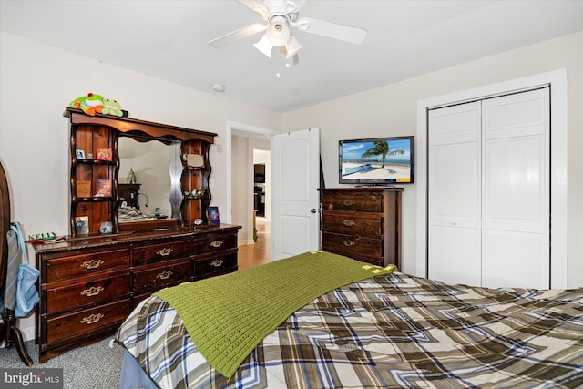 bedroom with ceiling fan and a closet