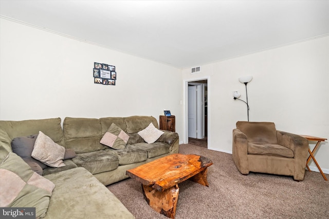 living room featuring carpet and ornamental molding