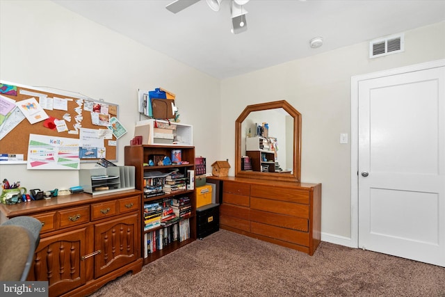 interior space featuring ceiling fan and carpet floors