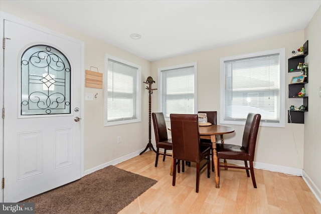 dining area with light wood-type flooring