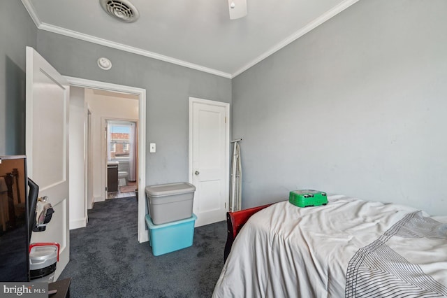 carpeted bedroom with ceiling fan and crown molding