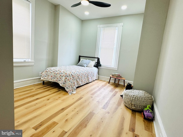 bedroom featuring ceiling fan and wood-type flooring