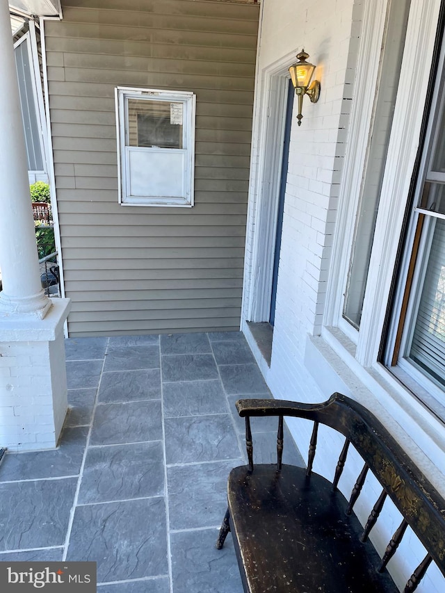 view of patio featuring a porch