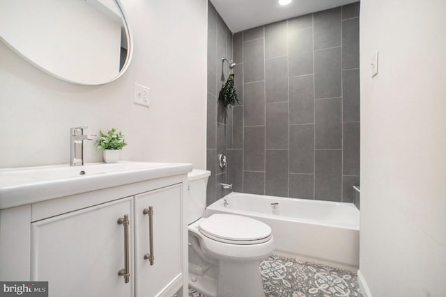 full bathroom with vanity, toilet, and tiled shower / bath