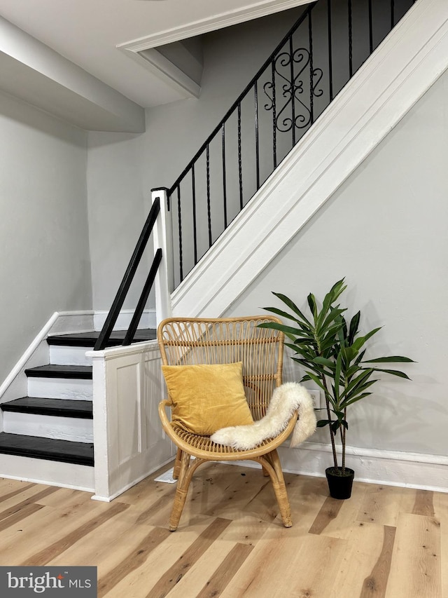 stairs with hardwood / wood-style floors