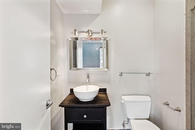 bathroom with toilet and vanity