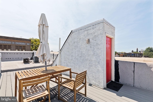 wooden deck with outdoor dining space