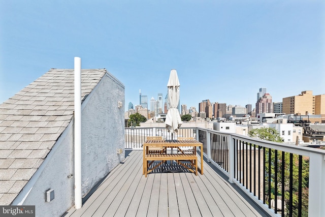 wooden deck with a city view