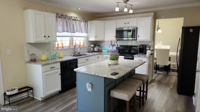 kitchen with dark hardwood / wood-style flooring, black appliances, a center island, sink, and white cabinetry