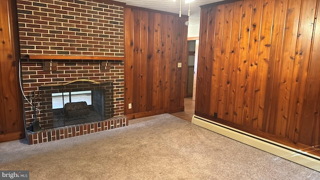 unfurnished living room featuring a brick fireplace, a baseboard radiator, carpet flooring, and wooden walls