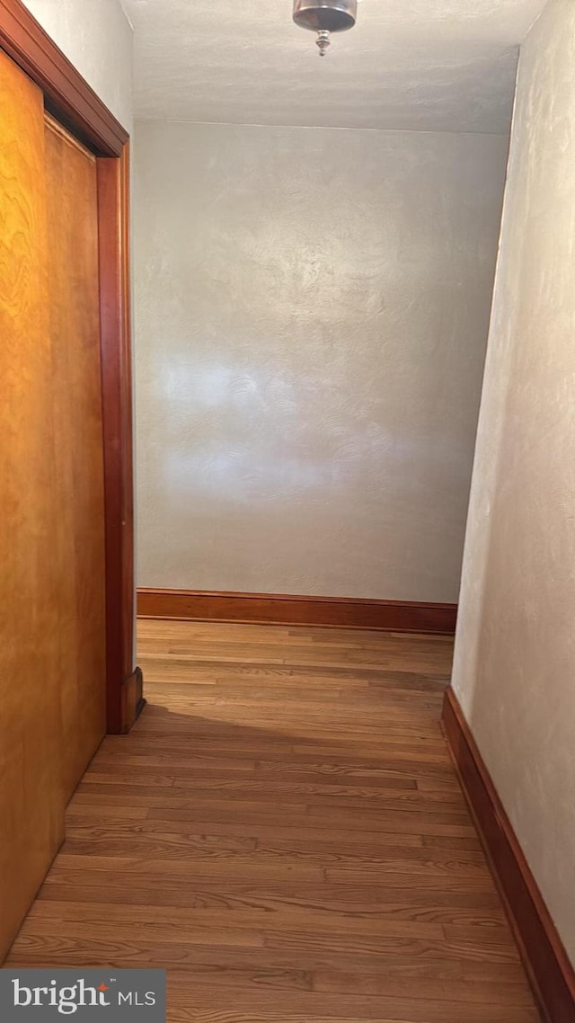 corridor featuring hardwood / wood-style flooring