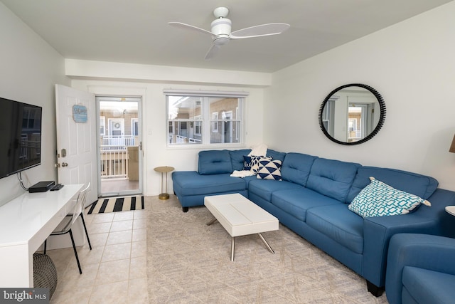 tiled living room with ceiling fan