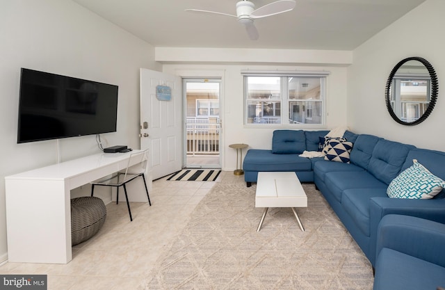 tiled living room featuring ceiling fan