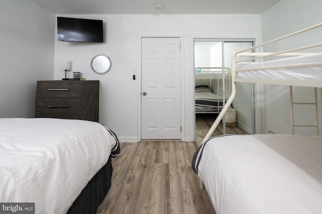 bedroom with light hardwood / wood-style floors