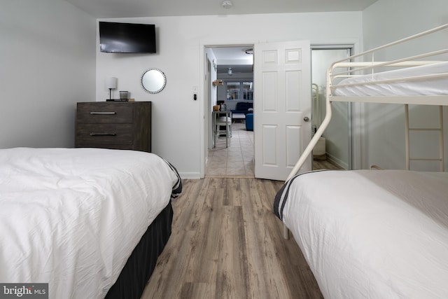 bedroom with hardwood / wood-style floors