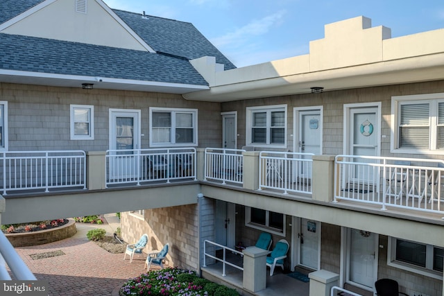 rear view of house featuring a balcony