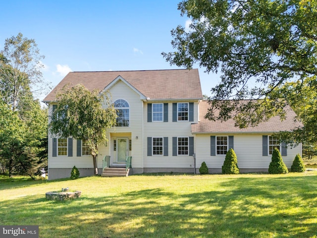 colonial-style house with a front lawn