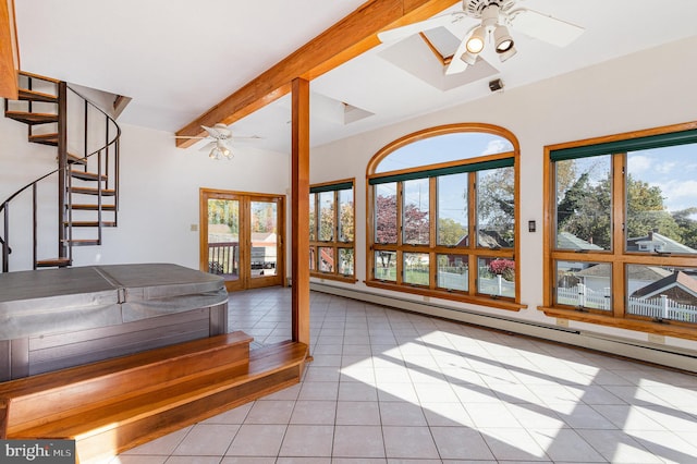 interior space featuring a baseboard heating unit, beam ceiling, ceiling fan, light tile patterned flooring, and french doors