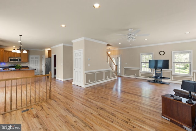 1159 Stoney Bottom Rd, Front Royal, VA 22630 - living area with stairs, a ceiling fan, light wood-style flooring, recessed lighting, and a chandelier