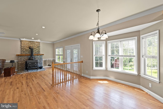 1159 Stoney Bottom Rd, Front Royal, VA 22630 - unfurnished living room featuring a chandelier, wood finished floors, crown molding, a wood stove, and recessed lighting
