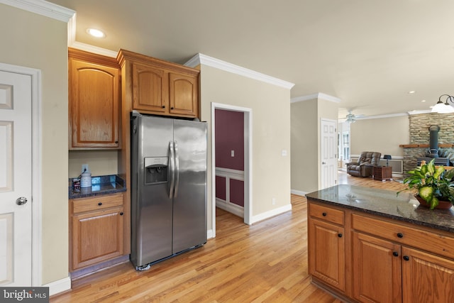 1159 Stoney Bottom Rd, Front Royal, VA 22630 - kitchen with stainless steel fridge with ice dispenser, light wood finished floors, dark stone countertops, ceiling fan, and brown cabinets
