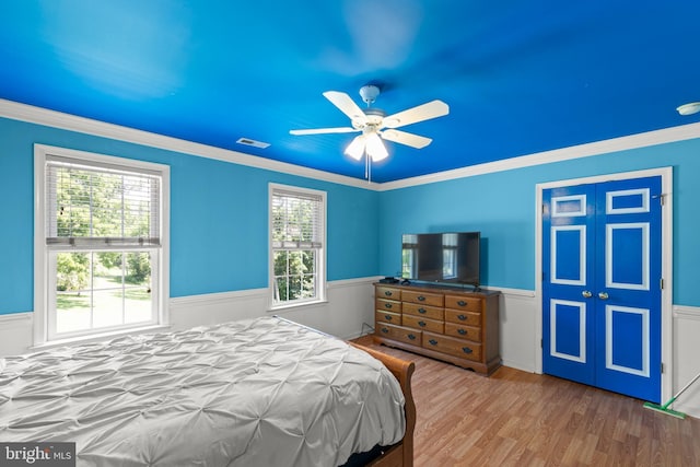 1159 Stoney Bottom Rd, Front Royal, VA 22630 - bedroom with a wainscoted wall, multiple windows, wood finished floors, crown molding, and a ceiling fan