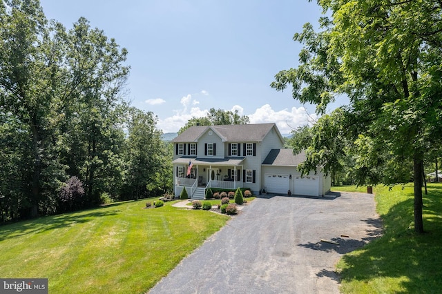 1159 Stoney Bottom Rd, Front Royal, VA 22630 - colonial home with covered porch, a garage, a front yard, and gravel driveway