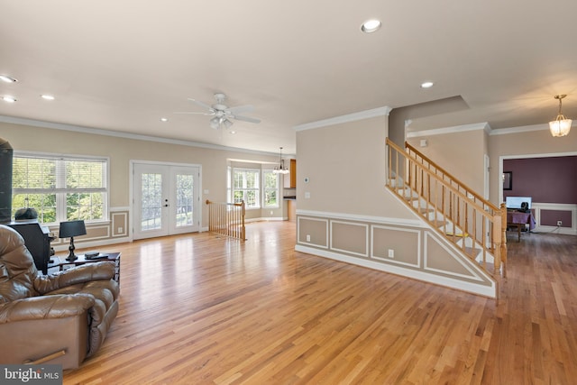 1159 Stoney Bottom Rd, Front Royal, VA 22630 - living room with crown molding, light wood-style flooring, a ceiling fan, french doors, and stairs