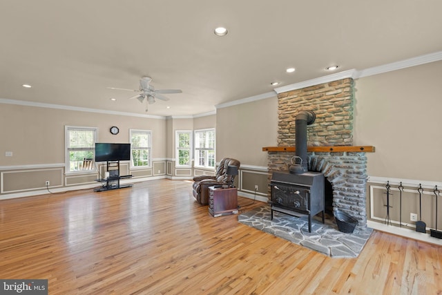 1159 Stoney Bottom Rd, Front Royal, VA 22630 - living area with wood finished floors, ceiling fan, a wood stove, recessed lighting, and ornamental molding