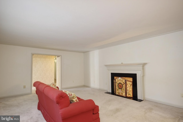 carpeted living room with crown molding