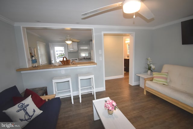 living room featuring crown molding, ceiling fan, and dark hardwood / wood-style floors