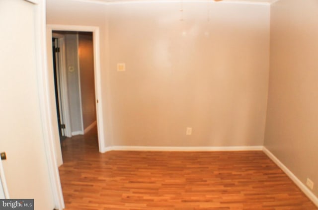 empty room featuring hardwood / wood-style floors