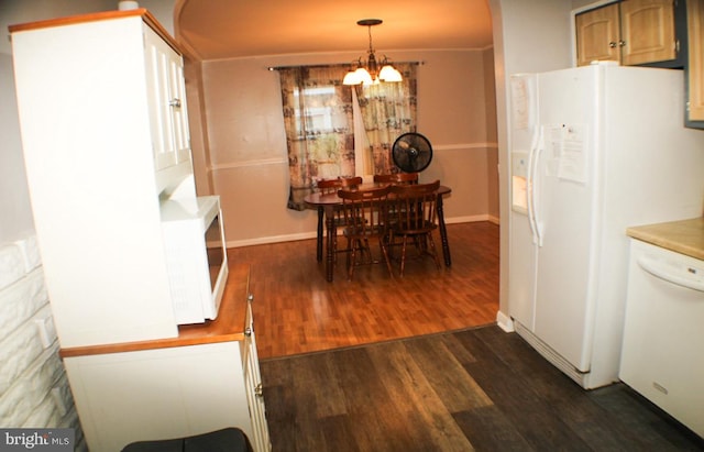 kitchen featuring a notable chandelier, white appliances, decorative light fixtures, and dark hardwood / wood-style flooring