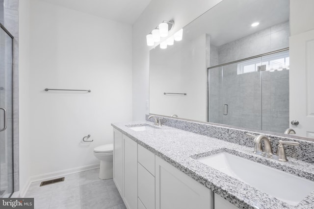 full bath featuring a stall shower, visible vents, and a sink