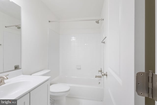 full bathroom featuring vanity, toilet, and tiled shower / bath combo