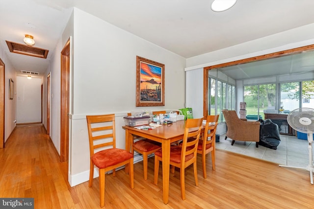 dining room with light hardwood / wood-style floors