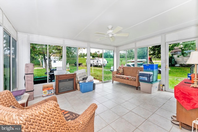 sunroom with ceiling fan and a healthy amount of sunlight